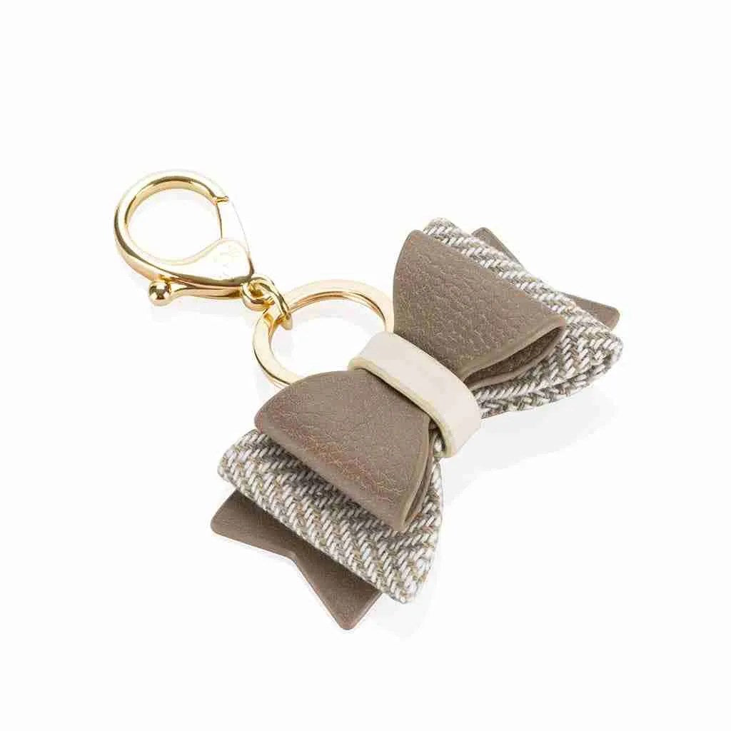 side view, bow keychain, taupe with white center