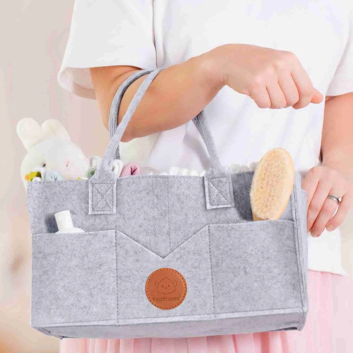 grey baby storage bin with open pockets and side pockets