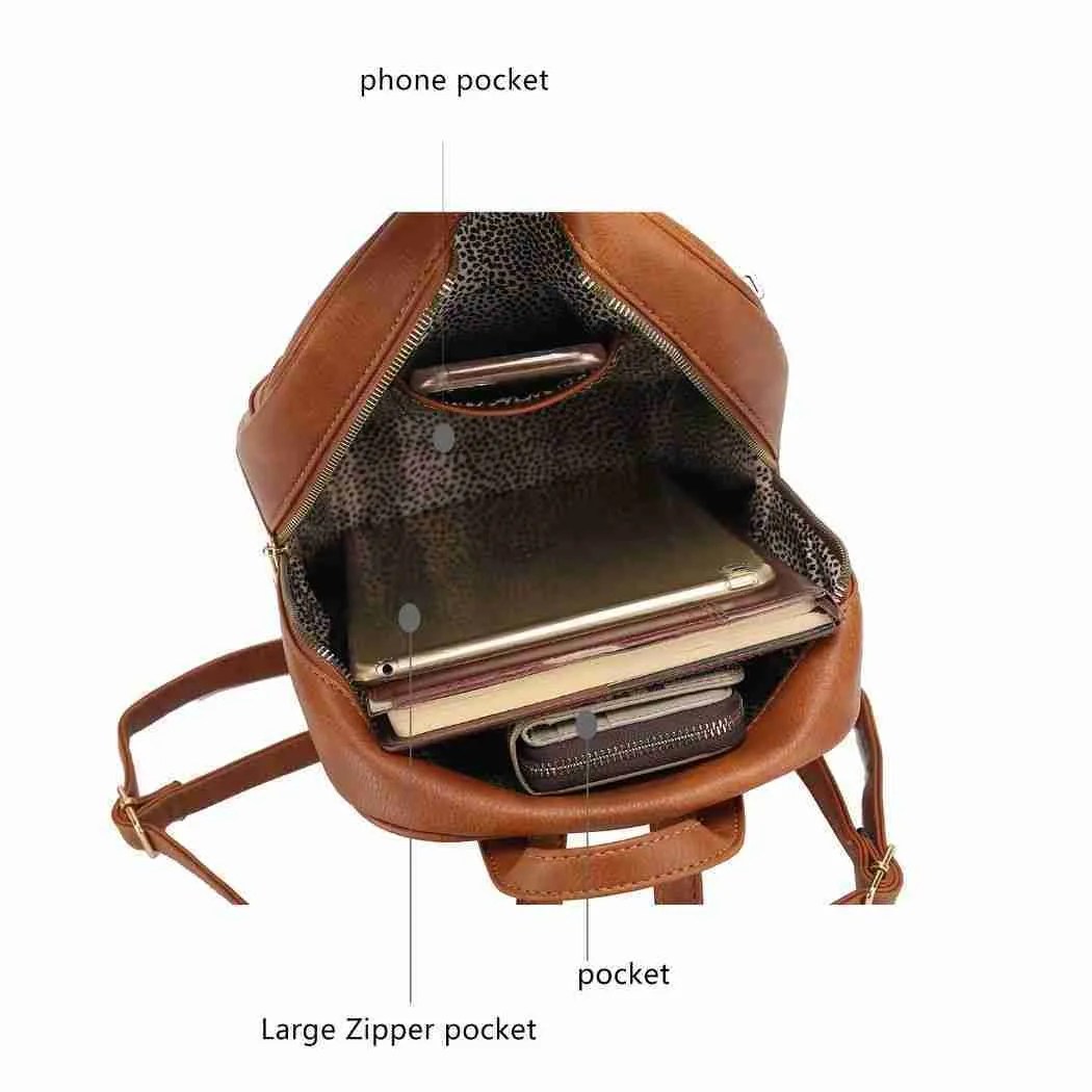 inside of bag showing cellphone in pocket and a large zipper pocket with an iPad